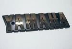 Yamaha XS650 1978-1981 Nos Lh Fuel Tank Badge 4G7-24161-00. Fixed Price $30.00.